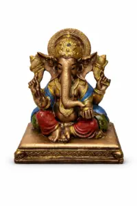 Lord Ganesha idol antique gold finish seated on decorative base for home temple and spiritual décor.